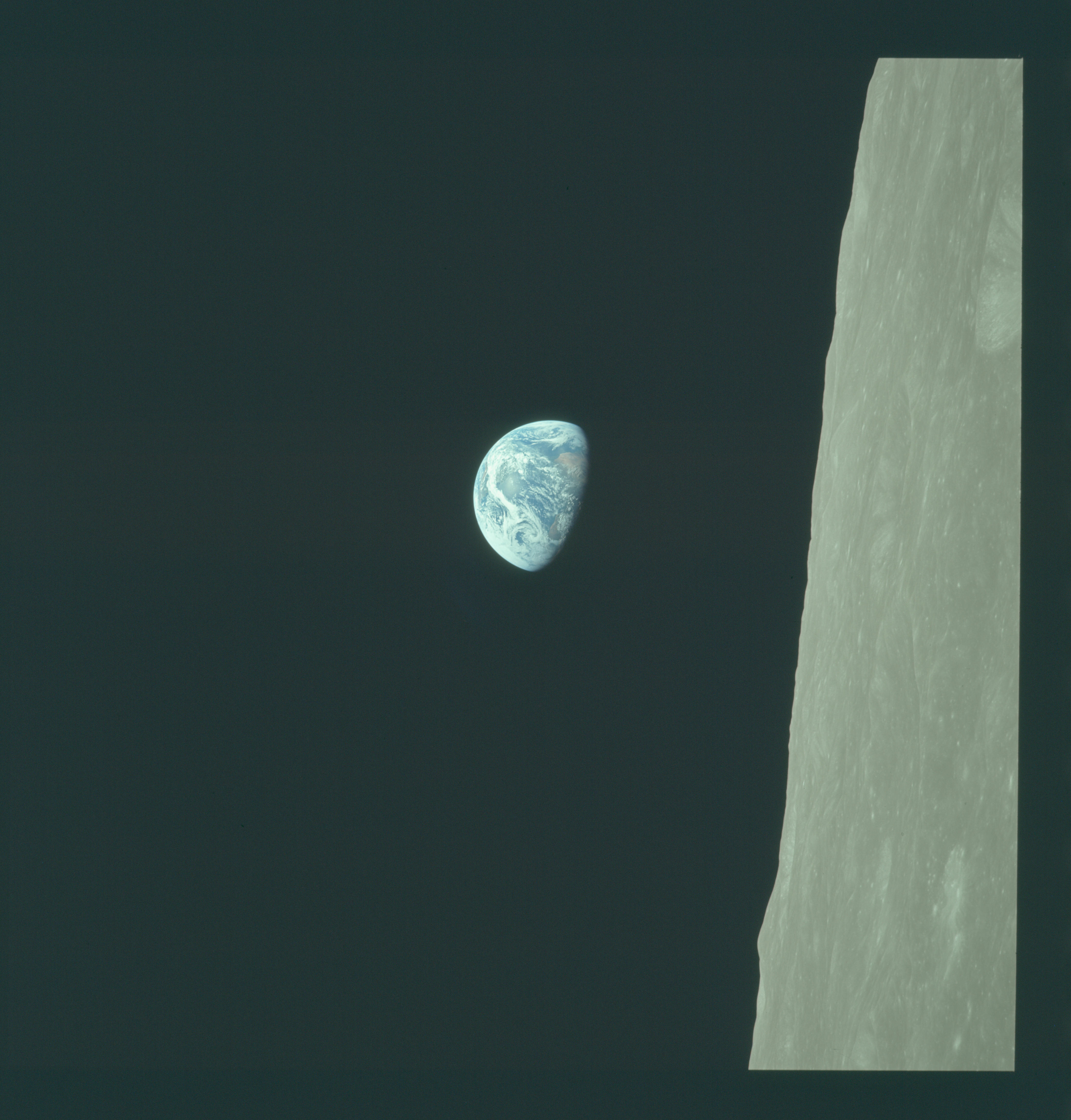 Bill Anders’ Apollo 8 Earthrise photograph, with Earth to the left of the lunar surface, matching the painting’s orientation.